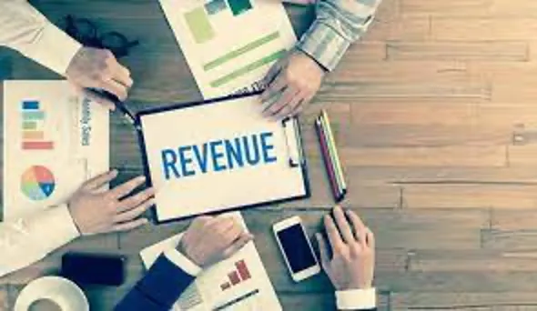 Hotel revenue team reviewing sales and pricing charts